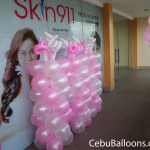 Pink & White-colored Balloon Pillars at Skin911