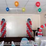 Justice League Balloon Pillars & Cake Arch at LEMCO