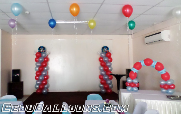 Justice League Balloon Pillars & Cake Arch at LEMCO