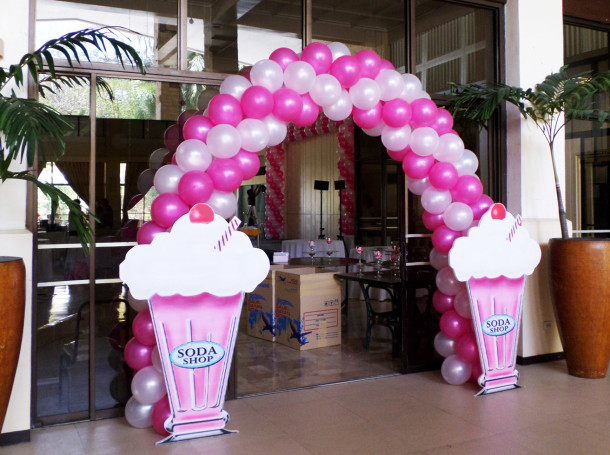Entrance Arch with Soda Pop Standee for a 1950s Theme Birthday